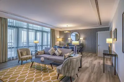 a living room with a couch and a table at Grand Hyatt Amman Residences in Amman