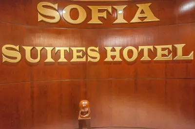 a sign for a santa claus hotel on a wall at Sofia Hotel in Amman