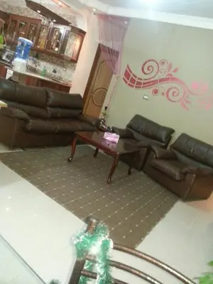 a living room with couches and a christmas tree at Z apartment in Az Zarqa