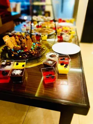 a table filled with different types of food at P Quattro Relax Hotel in Wadi Musa