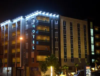 a building with lights on the side of it at Tilal Almadina Hotel & Suites in Amman