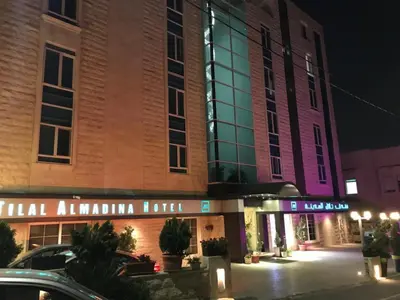 a building with a sign that reads hotel amazonulum hotel at Tilal Almadina Hotel & Suites in Amman