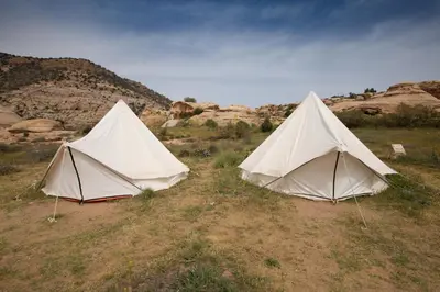 two tents in the middle of a field at Rummana Campsite in Dana