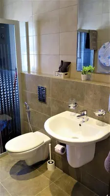 a bathroom with a sink and a toilet at Double Key by HR in Amman