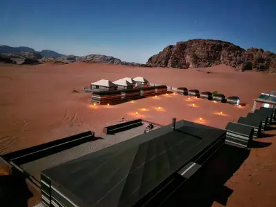 an aerial view of a resort in the desert at Wadi Rum Candles Camp in Wadi Rum