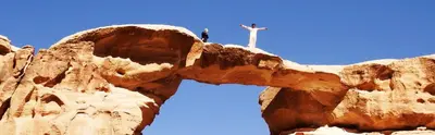 a statue of a cross on top of a mountain at Rumshines Camp in Wadi Rum