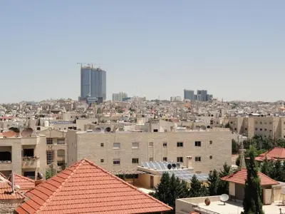 a view of a city with buildings and skyscrapers at Diyarkom Apartment in Amman