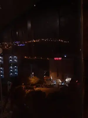 a view of a parking lot at night at Petra Cabin Inn Hostel&Resturant in Wadi Musa