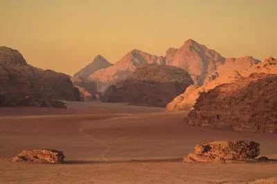 a view of a desert with rocks and mountains at Red Mountain Camp in Wadi Rum