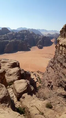 a view of the desert from the top of a mountain at Wadi Rum Nature Tours And Camp in Wadi Rum