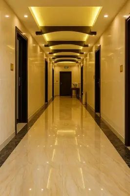 a hallway of a building with a long hall at Aljamal Hotel in Amman