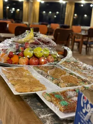 a table topped with lots of different types of food at Panorama Wadi Rum in Wadi Rum