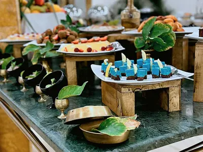 a buffet with many plates of food on a table at Sharah Mountains Hotel in Wadi Musa