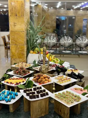 a buffet of different types of food on tables at Sharah Mountains Hotel in Wadi Musa