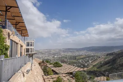 a view of a city from the side of a building at Sindyan Resort in Amman