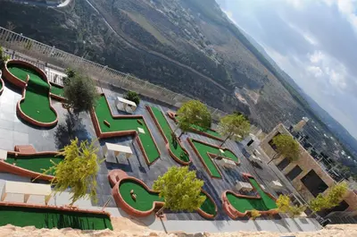 an aerial view of a water park with slides at Sindyan Resort in Amman