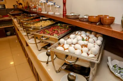 a buffet line with eggs and other food items at City Tower Hotel in Aqaba