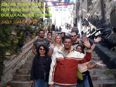a group of people standing on some stairs at Jordan Tower Hotel in Amman