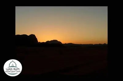 an image of a sunset in the desert at Wadi Rum Moon Light Camp in Wadi Rum