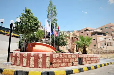 a street with flags on the side of the road at Silk Road Hotel in Wadi Musa