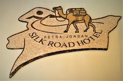a drawing of a camel on top of a flag at Silk Road Hotel in Wadi Musa