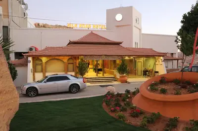 a car parked in front of a building at Silk Road Hotel in Wadi Musa