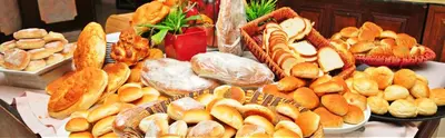 a table filled with different types of breads and pastries at Edom Hotel in Wadi Musa