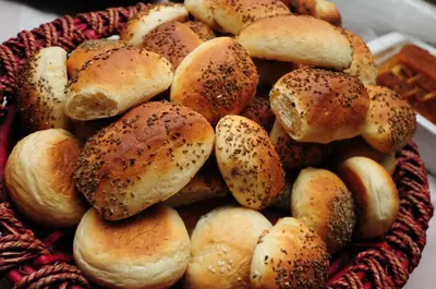 a pile of buns sitting in a basket at Edom Hotel in Wadi Musa