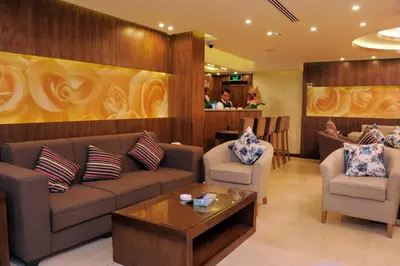 a living room with a couch and chairs and a table at Al Raad Hotel in Aqaba