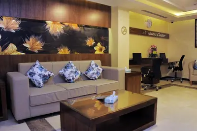 a living room with a couch and a table at Al Raad Hotel in Aqaba