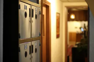 a row of lockers in a room with a hallway at The Sydney Hotel in Amman