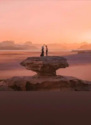 a couple standing on a rock in the water at Yazan Desert Camp in Wadi Rum