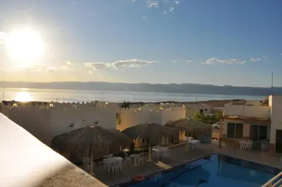 a view from the balcony of a resort with a swimming pool at Red Sea Dive Center in Aqaba