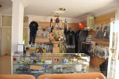 a display case in a room filled with umbrellas at Red Sea Dive Center in Aqaba