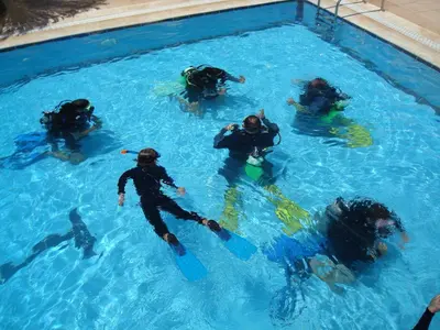 a group of people in a swimming pool at Red Sea Dive Center in Aqaba