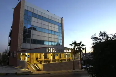 a hotel with a hotel sign in front of a building at 360 Hotel By FHM in Amman