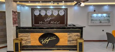 a counter in a store with a sign above it at Venus Hotel in Wadi Musa