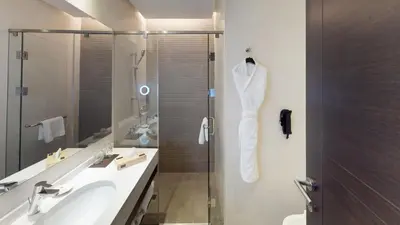 a bathroom with a shower and a sink and a toilet at The House Boutique Suites in Amman