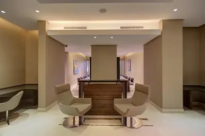 a waiting room with chairs and a podium at The House Boutique Suites in Amman