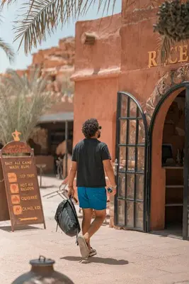 a man walking in front of a building at Bait Ali in Wadi Rum