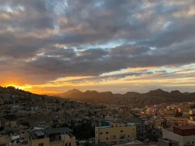 a view of a city at sunset at Valentine Inn in Wadi Musa