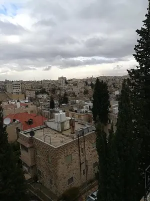 an aerial view of a city with buildings at Shams Alweibdeh Hotel Apartments in Amman