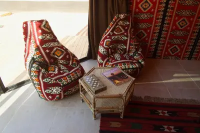 two bags and a box sitting on the floor at Arabian Nights in Wadi Rum