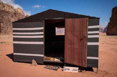 a black and white out house in the desert at Arabian Nights in Wadi Rum