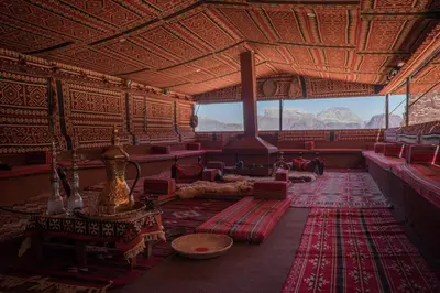 a room with red carpets in a room with mountains at Arabian Nights in Wadi Rum