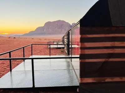 a building in the desert with a view of the desert at Wadi Rum Shooting Stars Camp in Wadi Rum