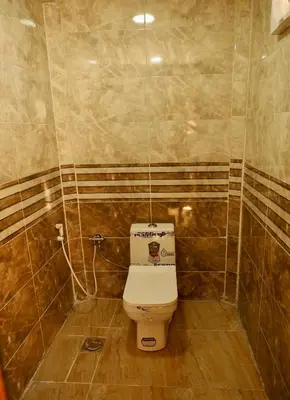a small bathroom with a toilet in a room at Wadi Rum experience in Wadi Rum