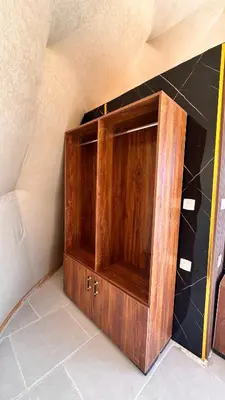 a wooden cabinet in the corner of a room at Wadi Rum experience in Wadi Rum