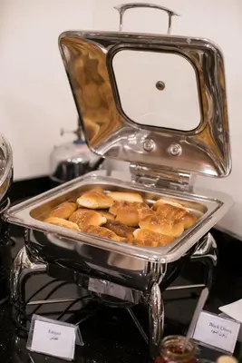 a toaster sitting on top of a table with food at Dweik Hotel 2 in Aqaba