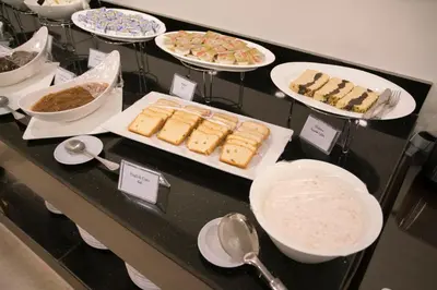 a buffet with plates of food on a table at Dweik Hotel 2 in Aqaba